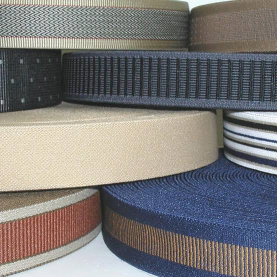 Custom developed narrow fabric samples on a workbench